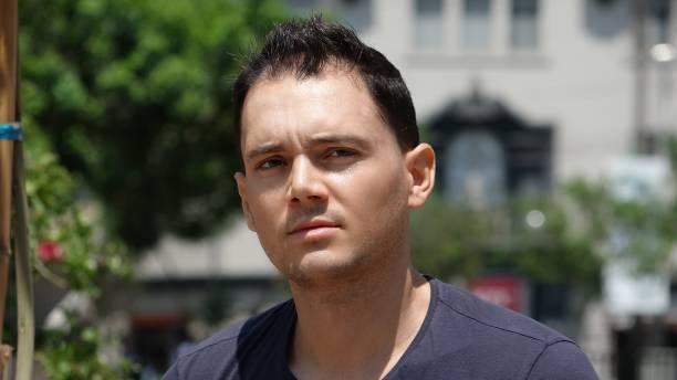 istock Serious Man Gazing In Urban Park 682108306