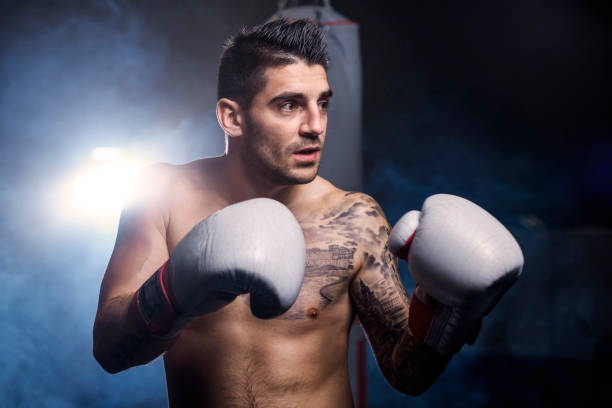 istock Mid adult man in boxing gloves 682118042