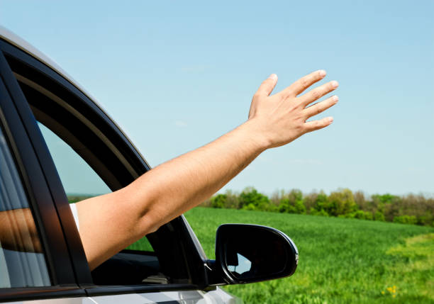 istock Man inside car showing his hand 682118504