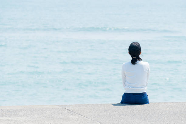 istock Woman at the seaside 682119404