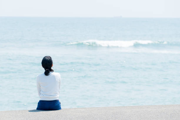 istock Woman at the seaside 682119766
