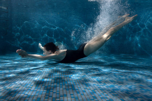 istock Woman quickly swims under the water. 682123464