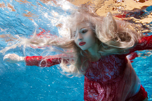 istock Surrealism is a woman underwater. 682125594