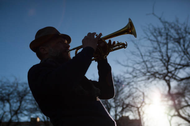 istock Man with golden trumplet 682126550