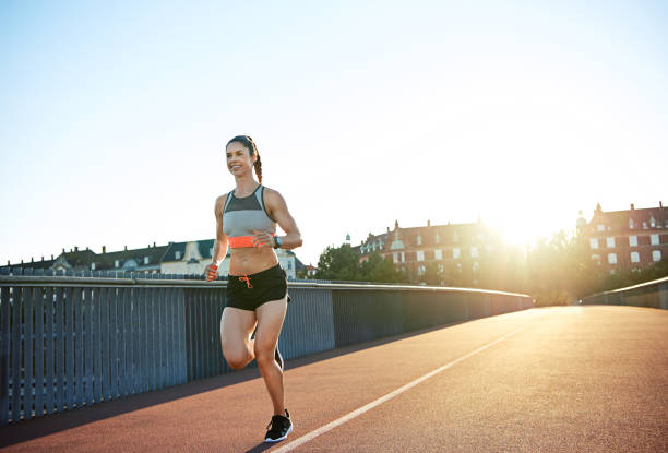 istock Athletic young woman enjoying a morning run 682130258