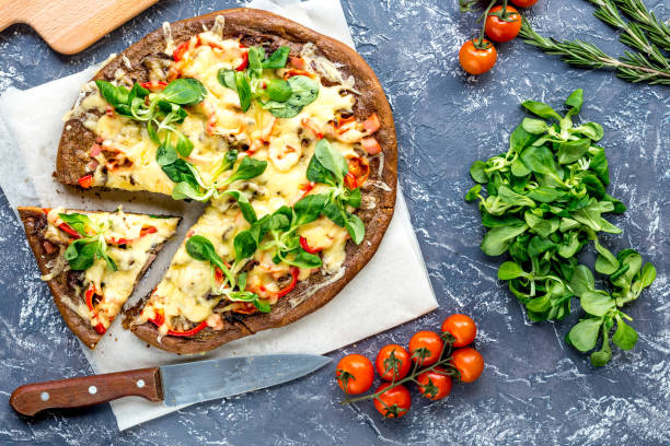 istock cooking pizza with vegetables and cheese on stone desk background top view 682132866