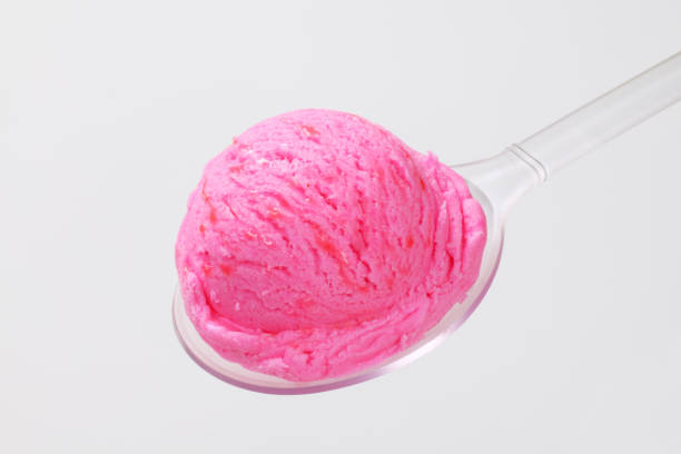 istock Scoop of pink ice cream on spoon 682133414