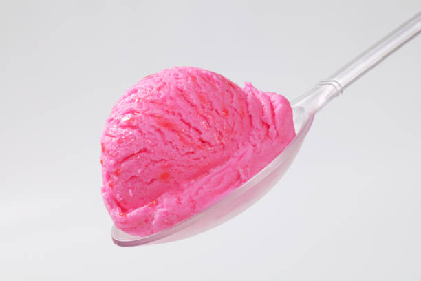 istock Scoop of pink ice cream on spoon 682133460