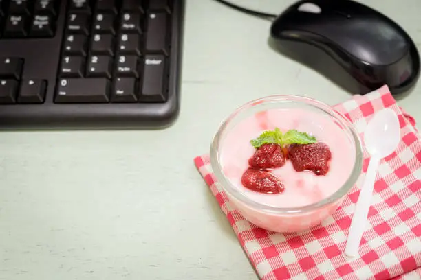 strawberry yogurt on desk