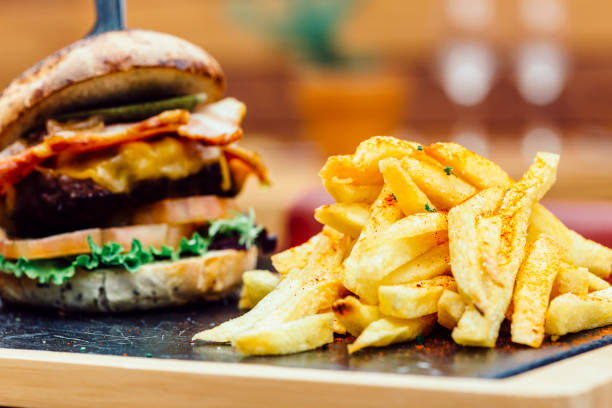 istock Traditional plate of chips and burger sandwich 682147704