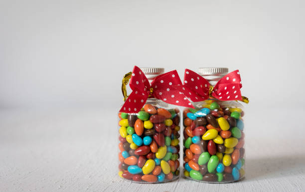 istock Baby Gift Colorful candies in jar on table 682147942