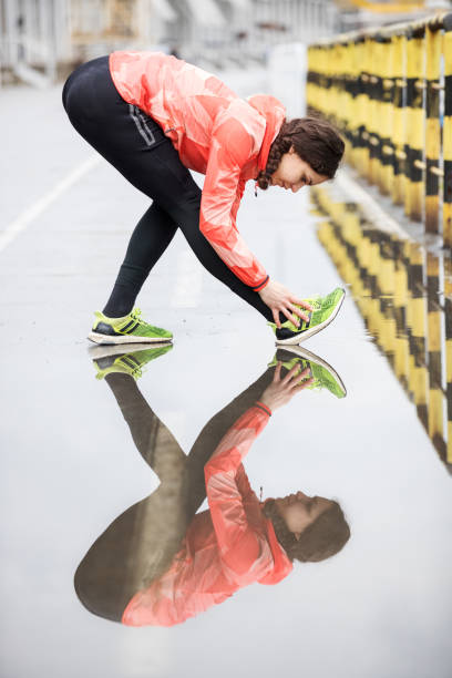 istock Fit woman stretches after work out 682148212