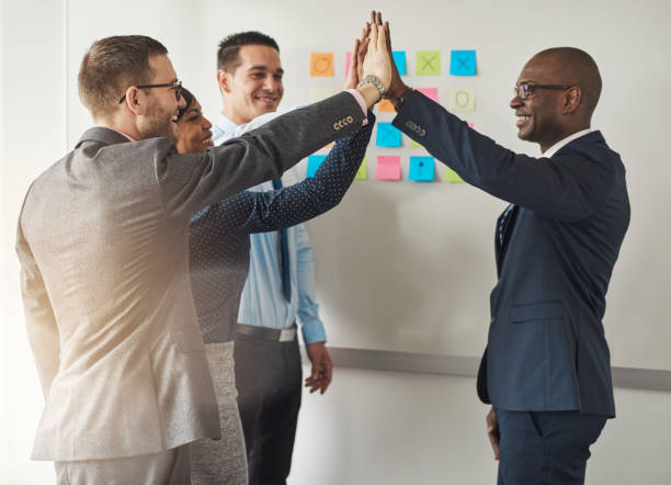 istock Group of business executives congratulating 682148682