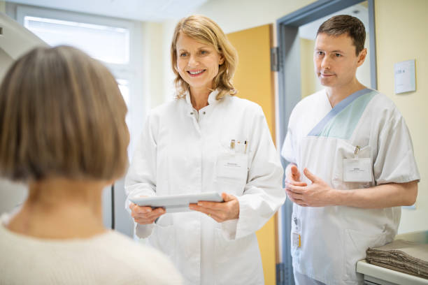 istock Doctors and senior patient discussing at hospital 682151274