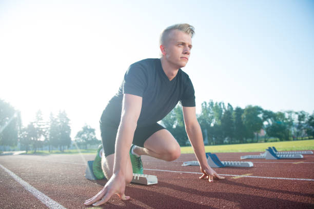 istock Runners preparing for race at starting blocks 682151710