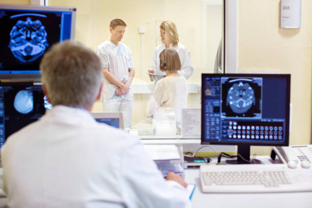 istock Mature doctor analyzing X-rays in examination room 682152038