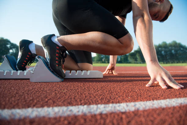 istock Runners preparing for race at starting blocks 682155008