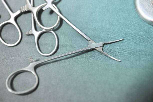 istock Detail shot of steralized surgery instruments with a hand grabbing a tool 682155288
