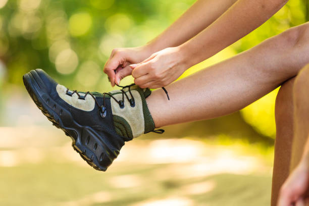 istock Hiker preparing their footwear. 682155586
