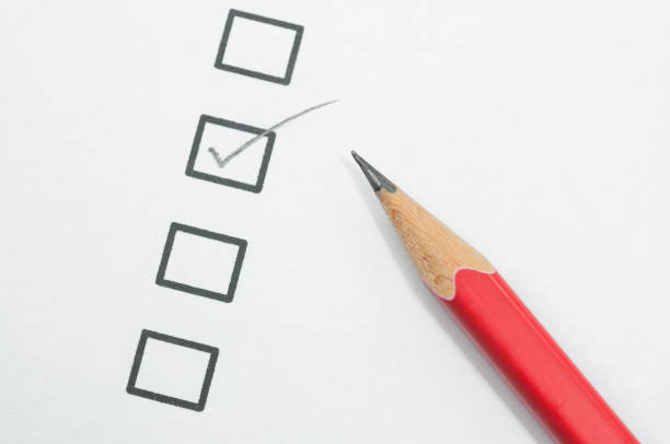 istock checklist box and red pencil on white paper. 682162150