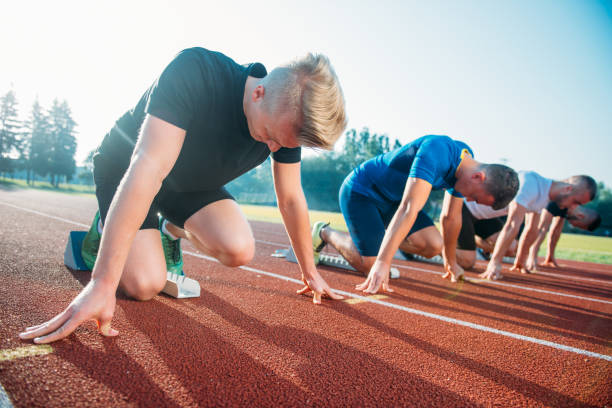 istock Runners preparing for race at starting blocks 682162906