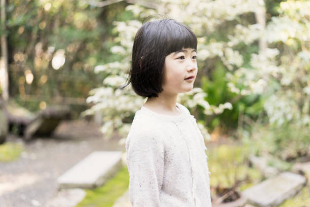 A portrait of a small cute elementary age school girl.
