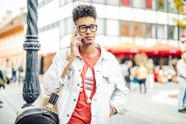 istock Young man using phone in the city 682163430