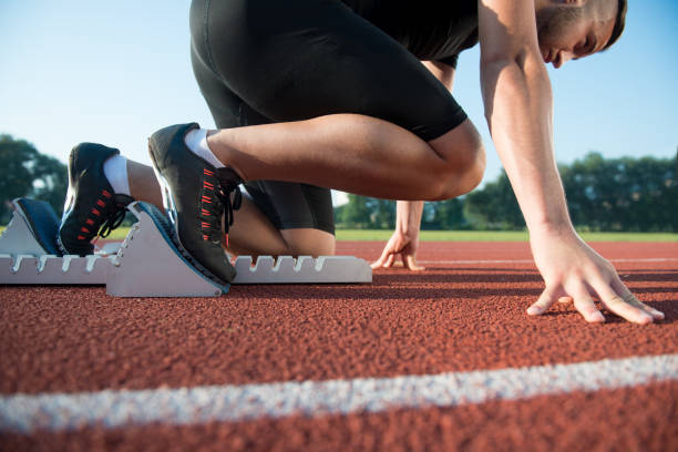 istock Runners preparing for race at starting blocks 682167882
