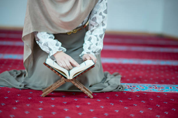 istock muslim woman praying in mosque 682168144
