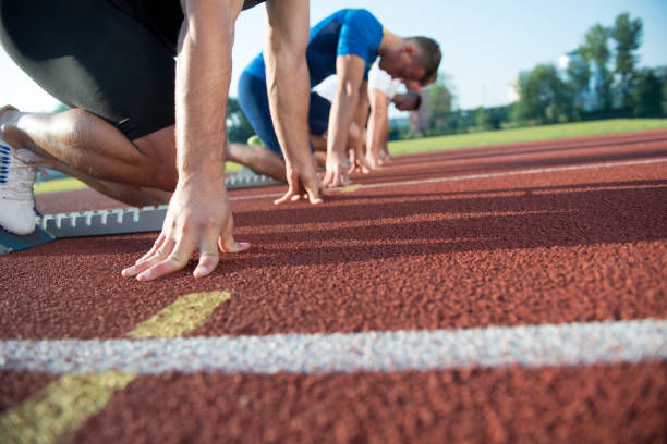 istock Runners preparing for race at starting blocks 682168860
