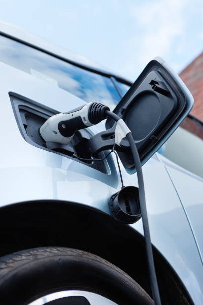 istock Electric car being charged. Low angle view. Vertical. 682171152