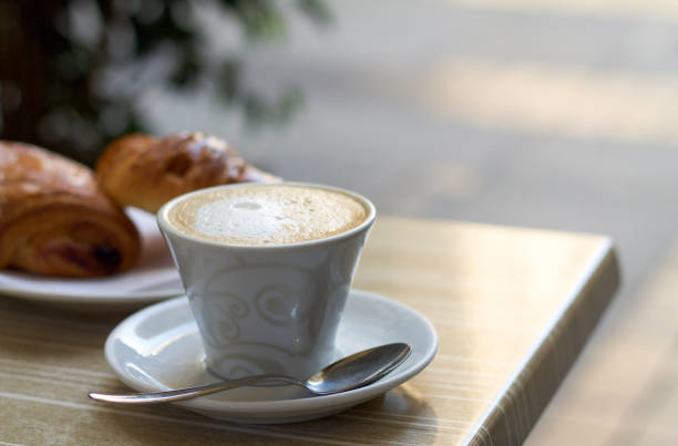 istock cappuccino cup with milk cream on the table 682171208