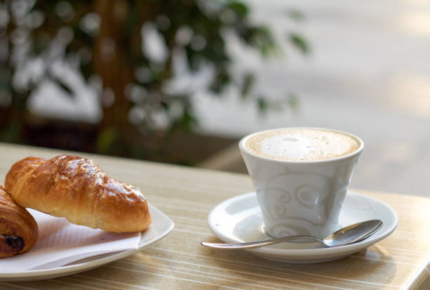 istock italian breakfast , cappuccino and brioche 682171350