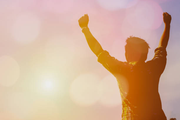 istock Silhouette of happy people in sunset. 682173520
