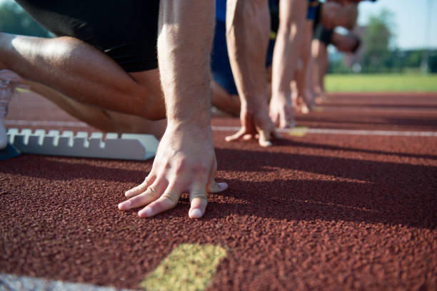 istock Runners preparing for race at starting blocks 682176380