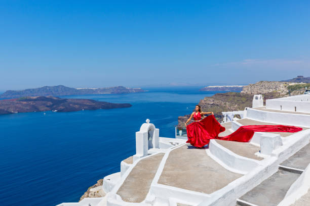 istock Woman in long red dress 682180170