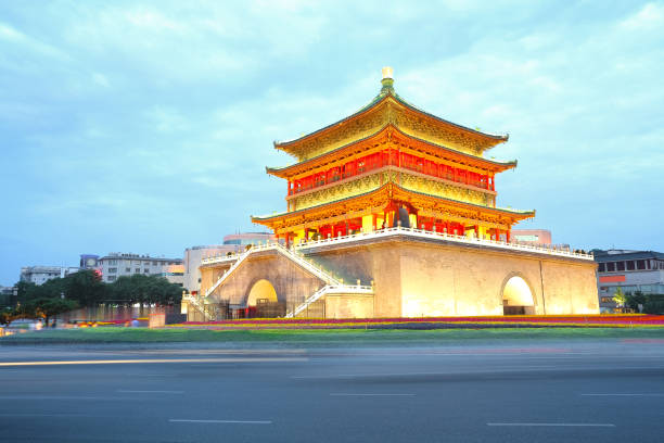 istock Empty road surface floor with Ancient City Tower of night scene in Xi'an 682180586