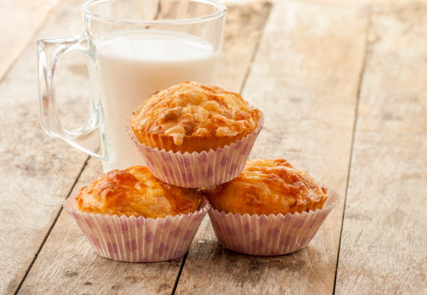 istock Savory cheese and bacon muffins on the wooden table 682183462