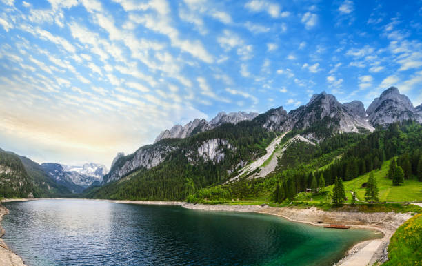 istock Alpine summer lake sunset panorama. 682186358