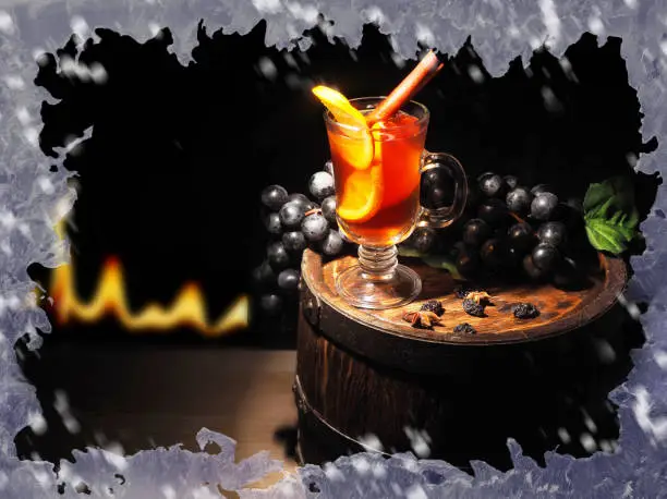 Glass of mulled wine on wooden barrel.Glass of mulled wine on wooden barrel.