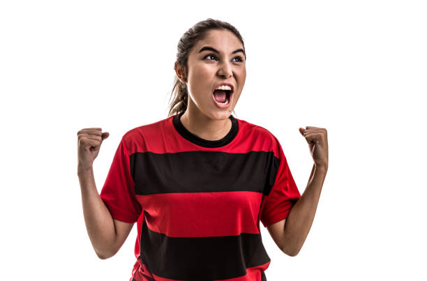 istock Soccer woman on red uniform celebrating on white background 682186644