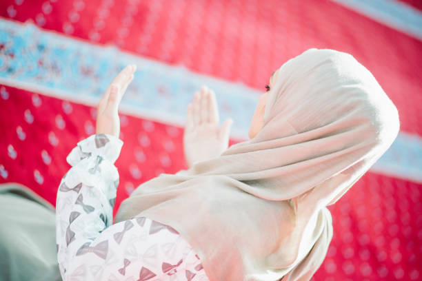 istock muslim woman praying in mosque 682189828