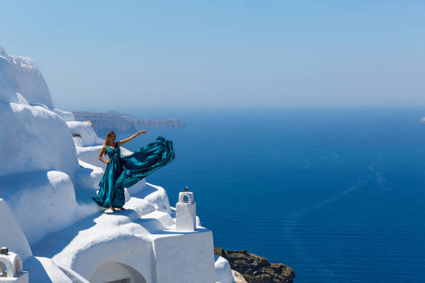 istock Woman in long blue dress 682189902