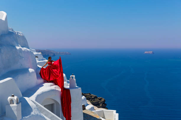 istock Woman in long red dress 682190154