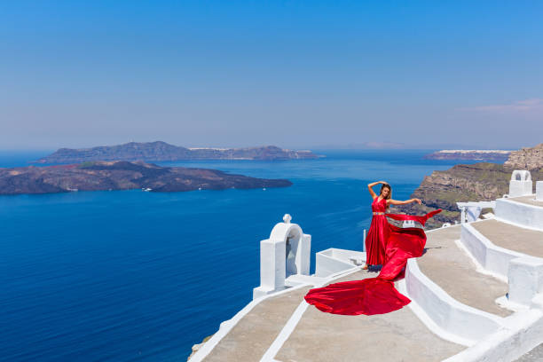 istock Woman in long red dress 682190236