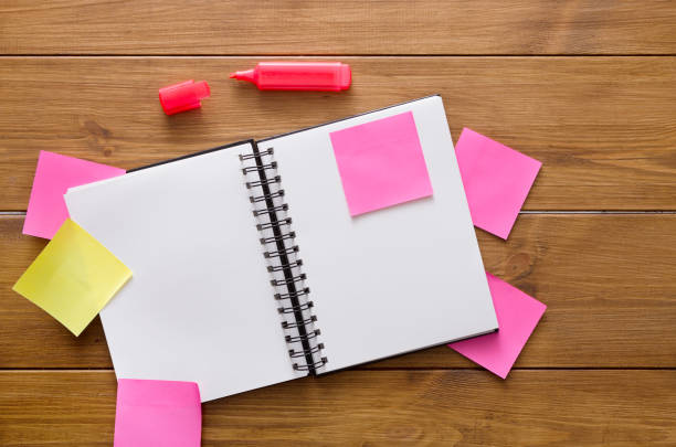 istock Top view of blank notepad on wooden office desk 682190704