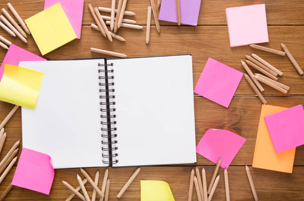 istock Top view of blank notepad on wooden office desk 682190760