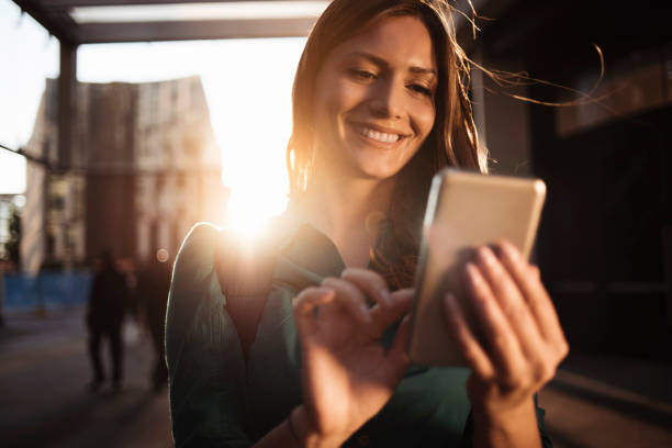istock Happy girl checking her mobile 682193308