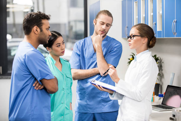 istock group of medical workers discussing work in laboratory 682194184
