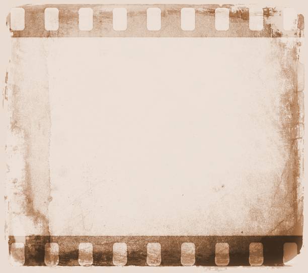 istock Vintage sepia film strip frame with worn borders. 682197042